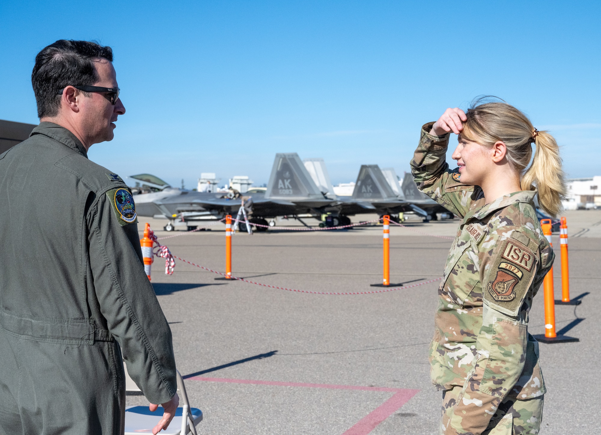 U.S. Air Force Col. Kevin Jamieson (left), 3rd Air Expeditionary Wing commander, out of Joint Base Elmendorf-Richardson, Alaska, speaks with U.S. Air Force Airman First Class Hannah Roberson, 525th Expeditionary Fighter Squadron intelligence specialist, during Exercise Bamboo Eagle 24-1 at spoke Naval Air Station North Island, California, Jan. 31, 2024.