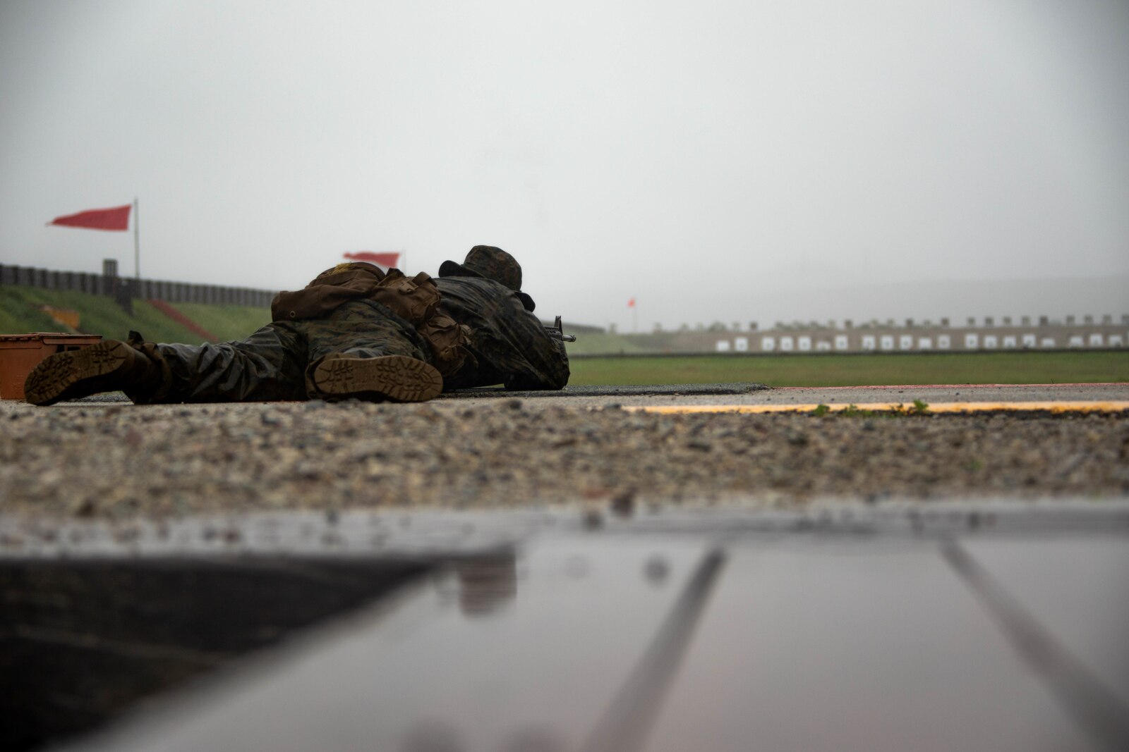 A U.S. Marine Corps recruit with Delta Company, 1st Recruit Training Battalion, aims down range during a table one course of fire at Marine Corps Base Camp Pendleton, California, Feb. 5, 2024. Table one course of fire is designed to introduce recruits to the basic fundamentals of marksmanship and rifle safety. (U.S. Marine Corps photo by Cpl. Joshua M. Dreher)