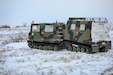 Army National Guard Staff Sgt. Caleb Frawley, an infantryman with Bison Company, 1st Battalion, 297th Infantry Regiment, from Fairbanks, navigates a Small Unit Support Vehicle through snow-covered terrain near the Alaska Army National Guard Readiness Center in Bethel, Feb. 3, 2024. The rugged terrain in Western Alaska served as an ideal testing ground for arctic warfare preparation. (Alaska National Guard photo by Balinda O’Neal)