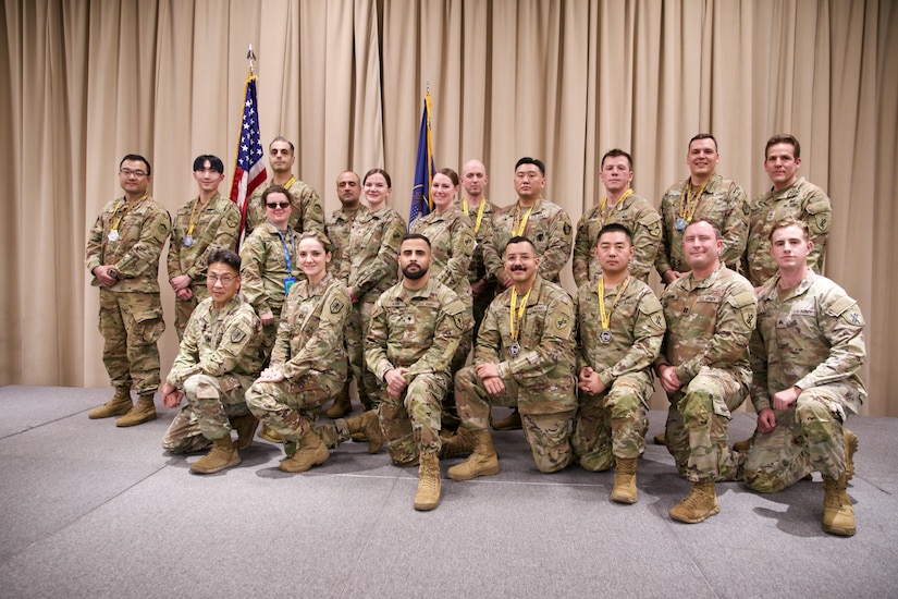 Soldiers pose for a photograph.