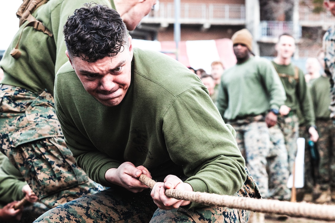 U.S. Marine Corps Lance Cpl. Tyler Brothers, an Oxford, Alabama native and field artillery fire control Marine with 10th Marine Regiment, 2d Marine Division, pulls a rope during a game of tug of war as part of the King’s Games field meet at Camp Lejeune, North Carolina, on Feb 2, 2024. King’s Games is an annual event where Marines from 10th Marines compete in various competitions to strengthen the unit’s esprit de corps and honor the patron saint of field artillery, Saint Barbara. (U.S. Marine Corps photo by Lance Cpl. Eric Dmochowski)