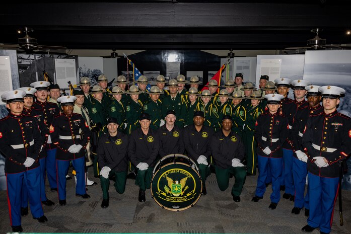 Members of the United States Forest Service Honor Guard and Band, pose for a group photo at Marine Corps Recruit Depot San Diego, Feb. 2, 2024. U.S. Forest Service Honor Guard and Band based out of Washington, D.C. conducted training with the U.S. Marines assigned to Marine Corps Recruit Depot San Diego to enhance their color guard and funeral detail techniques. (U.S. Marine Corps photo by Lance Cpl. Jacob B. Hutchinson)