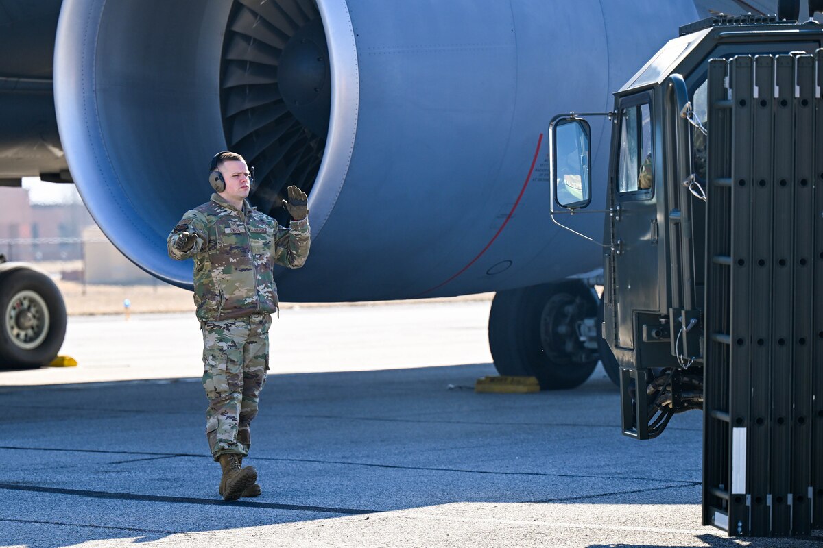 man guides cargo