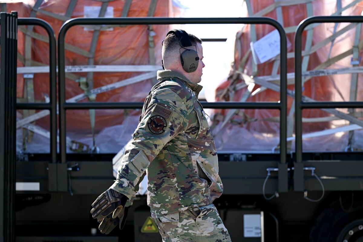 man inspects cargo