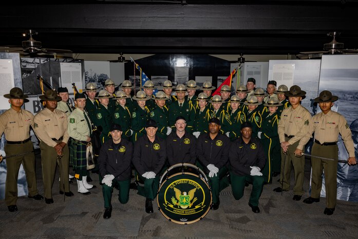 Members of the United States Forest Service Honor Guard and Band, pose for a group photo at Marine Corps Recruit Depot San Diego, Feb. 2, 2024. U.S. Forest Service Honor Guard and Band based out of Washington, D.C. conducted training with the U.S. Marines assigned to Marine Corps Recruit Depot San Diego to enhance their color guard and funeral detail techniques. (U.S. Marine Corps photo by Lance Cpl. Jacob B. Hutchinson)
