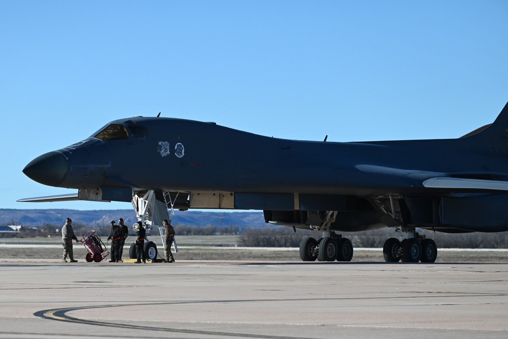 Airmen from the 28th Maintenance Group, Ellsworth Air Force Base, South Dakota, perform postflight checks on an Ellsworth AFB B-1B Lancer on the flightline at Dyess AFB, Texas, Feb. 3, 2024. (U.S. Air Force photo by Staff Sgt. Holly Cook)