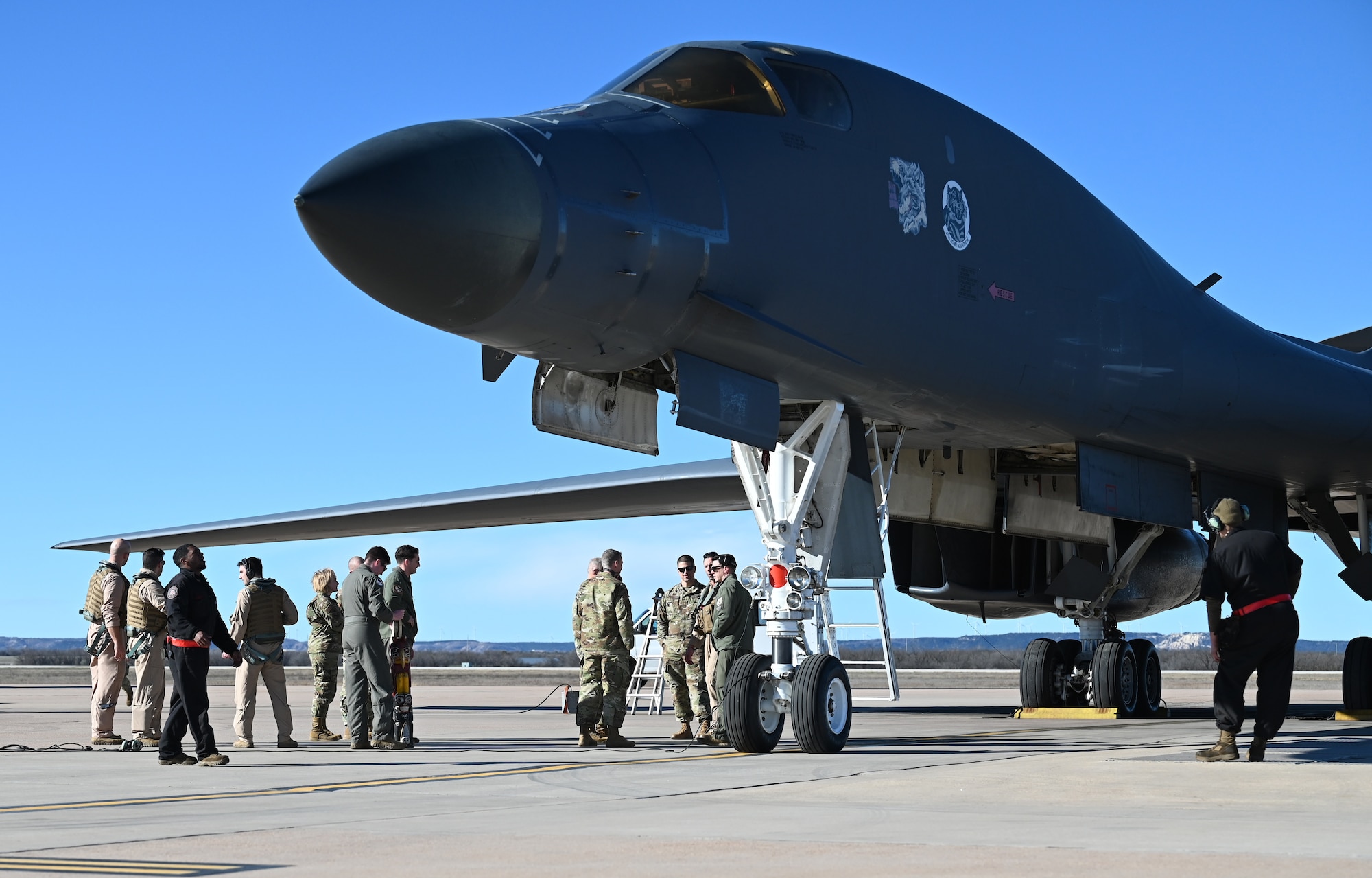 The 7th Bomb Wing leadership team greets Ellsworth Air Force Base, South Dakota, B-1B Lancer crewmembers on the flightline at Dyess AFB, Texas, Feb. 3, 2024. (U.S. Air Force photo by Staff Sgt. Holly Cook)