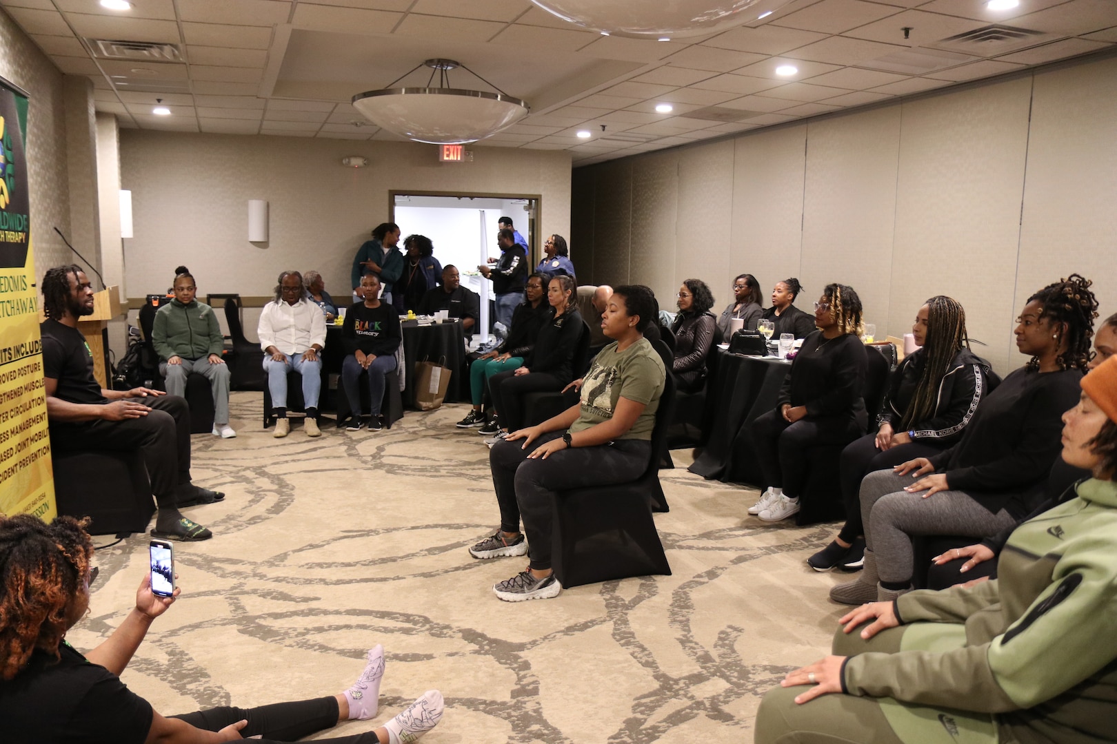 Members of the District of Columbia National Guard conduct stretch therapy during the Family Programs Health and Wellness workshop at the Holiday Inn Alexandria-Carlyle, Alexandria, Va., Jan 27, 2024. The workshop focused on mental health topics, stretch therapy, and nutrition.
