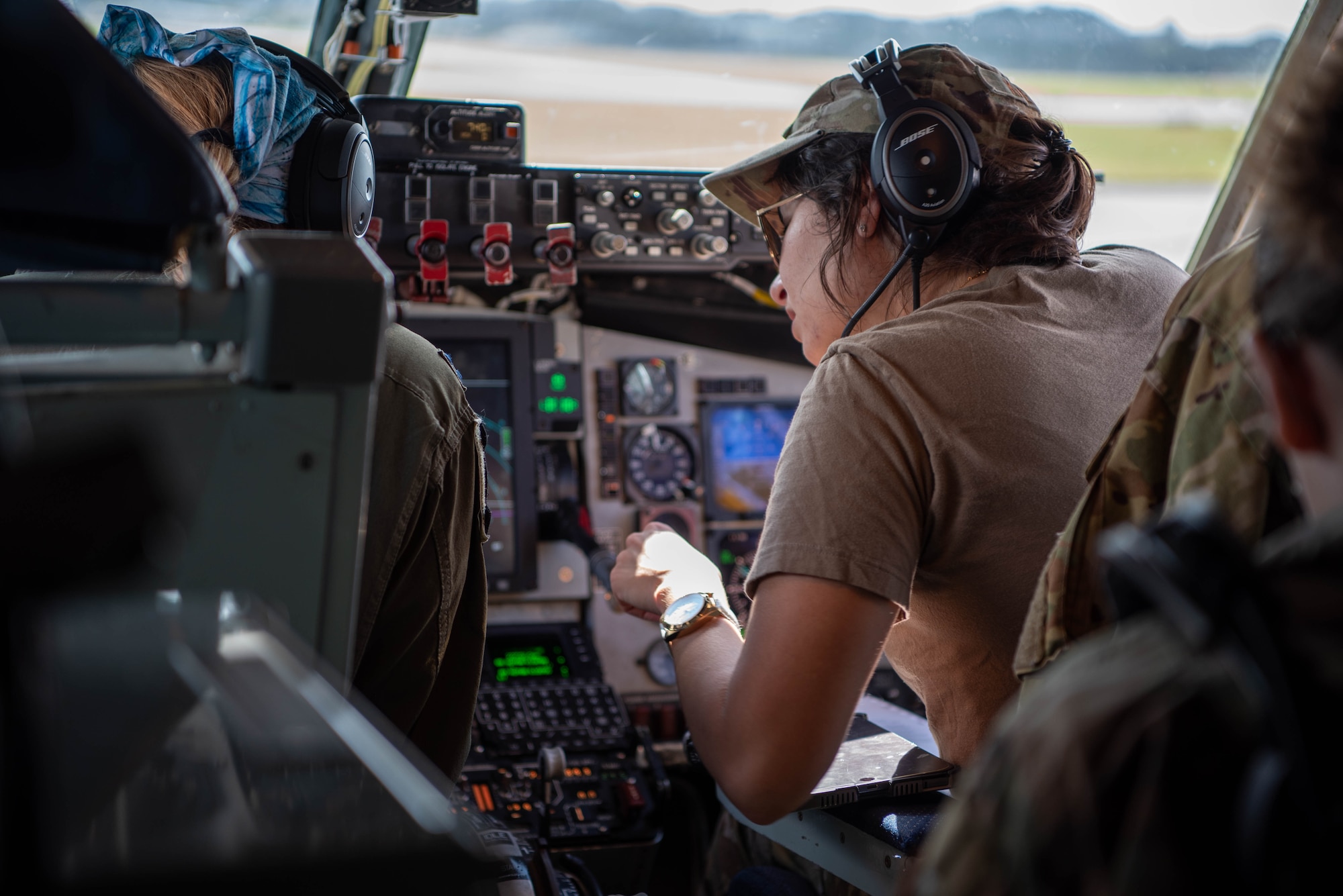 pilots looking at procedure binder before flight