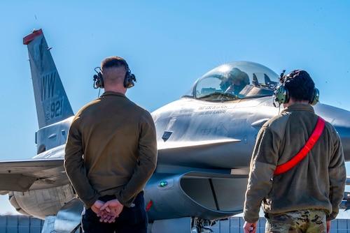 U.S. Air Force Airmen with the 13th Fighter Generation Squadron and a pilot with the 13th Fighter Squadron perform post-flight checks after arriving at Hyakuri Air Base, Japan, Jan. 26, 2024.