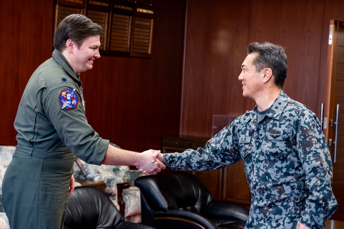 U.S. Air Force Lt. Col. Keegan Dale, 13th Fighter Squadron commander, receives a coin from Japan Air Self-Defense Force Maj. Gen. Tomohiro Matsuura, 7th Air Wing commander during the Aviation Training Relocation exercise at Hyakuri Air Base, Japan, Jan. 30, 2024.