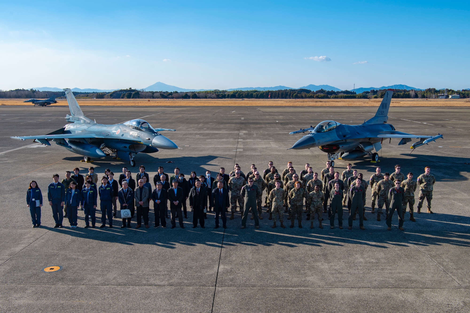 U.S. Air Force Airmen stand together with local civic leaders during the Aviation Training Relocation exercise at Hyakuri Air Base, Japan, Jan. 30, 2024.