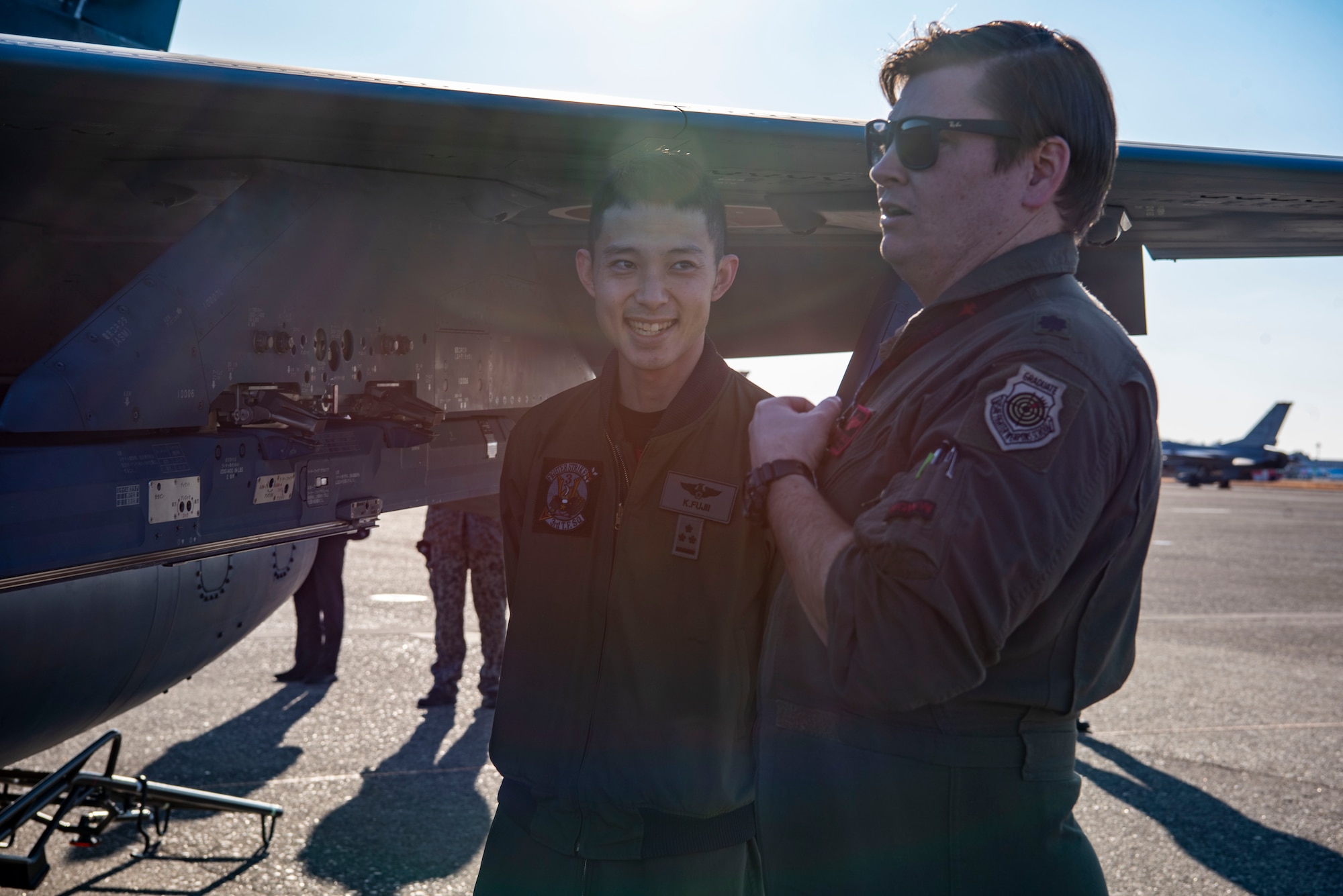 U.S. Air Force Lt. Col. Keegan Dale, 13th Fighter Squadron commander, speaks with a Japan Air-Self Defense Force F-2 pilot during the Aviation Training Relocation exercise at Hyakuri Air Base, Japan, Jan. 30, 2024.