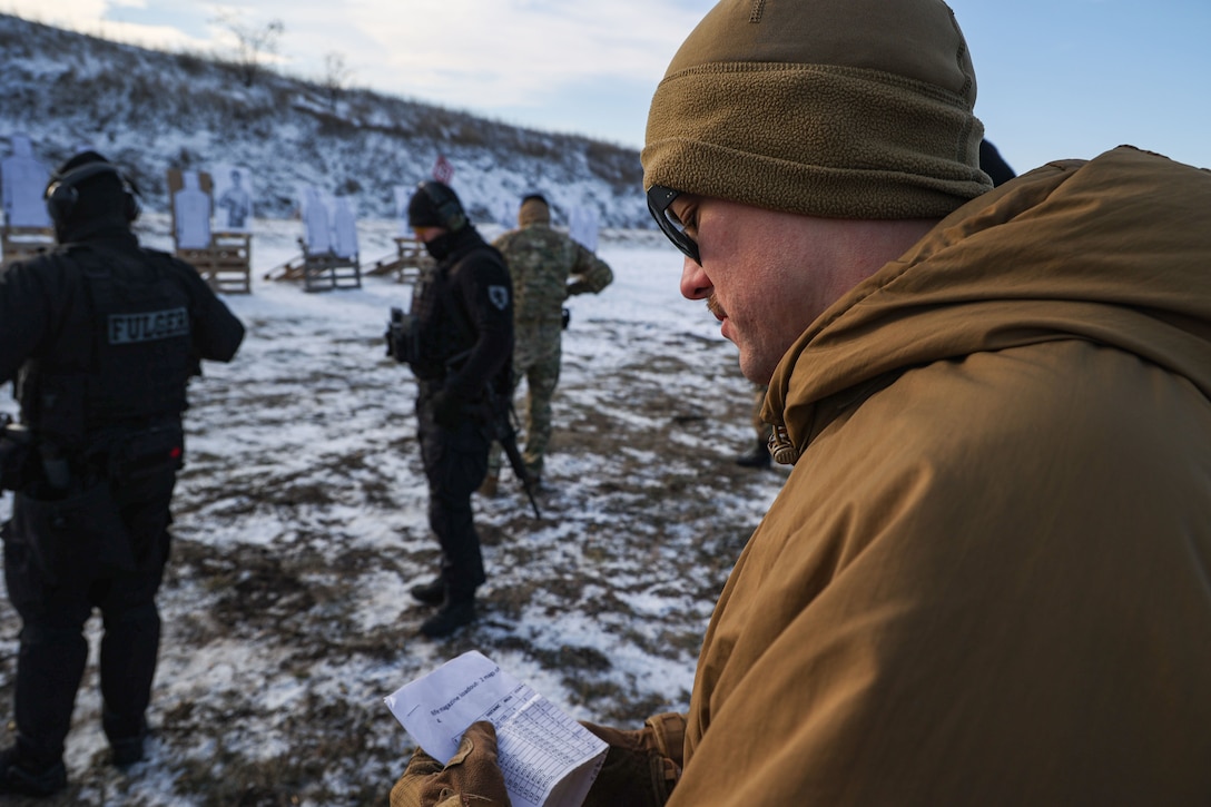 U.S. Marine Corps Lance Cpl. Zachary Harvey, a rifleman with Fleet Anti-Terrorism Security Team Company, Europe (FASTEUR), and Virginia native instructs Moldovan police forces on live fire rifle handling drills in Chișinău, Moldova, Jan. 23, 2024. Task Force 61/2.3 FASTEUR provides capabilities such as rapid response expeditionary anti-terrorism and security operations in support of Commanders, United States European Command and as directed by Commander, U.S. 6th Fleet in order to protect vital naval and national assets. (U.S. Marine Corps photo by Cpl. Cameron Ross)