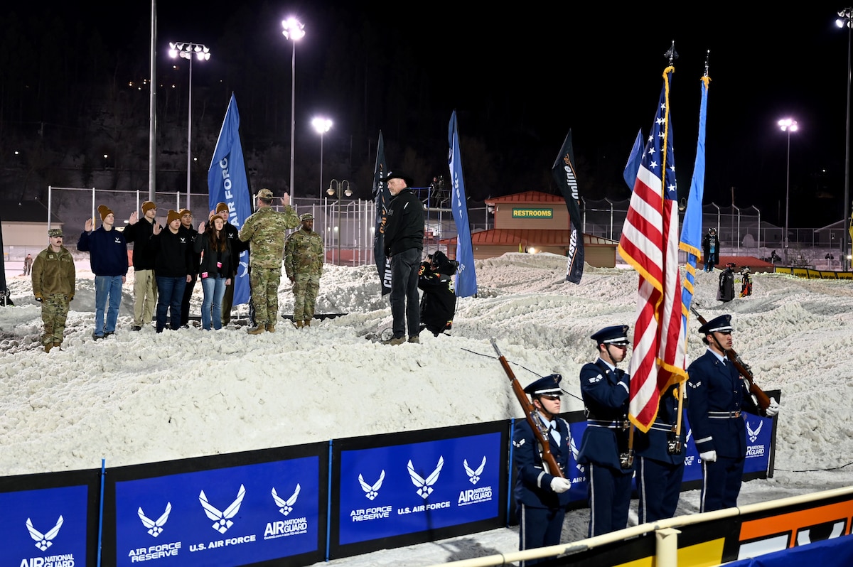 Air Force Recruiting Service deputy commander, conducts the oath of enlistment at the Snocross Championship in Deadwood, South Dakota, on Jan. 27, 2024.