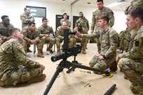 U.S. Soldiers with the Pennsylvania National Guard engage in hands-on learning in the classroom portion the crew served weapons course at Fort Indiantown Gap, Pennsylvania, Jan. 26, 2024. The crew served weapons course is offered through the Pennsylvania National Guard's Individual Training Branch. 28 students from units across the state honed their marksmanship skills by training on the M249 light machine gun, M240B machine gun, Mark 19 40 mm grenade machine gun and M2A1 machine gun to become subject matter experts on those weapon systems. (U.S. Army National Guard photo by Sgt. 1st Class Zane Craig)