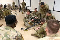 U.S. Soldiers with the Pennsylvania National Guard engage in hands-on learning in the classroom portion the crew served weapons course at Fort Indiantown Gap, Pennsylvania, Jan. 26, 2024. The crew served weapons course is offered through the Pennsylvania National Guard's Individual Training Branch. 28 students from units across the state honed their marksmanship skills by training on the M249 light machine gun, M240B machine gun, Mark 19 40 mm grenade machine gun and M2A1 machine gun to become subject matter experts on those weapon systems. (U.S. Army National Guard photo by Sgt. 1st Class Zane Craig)