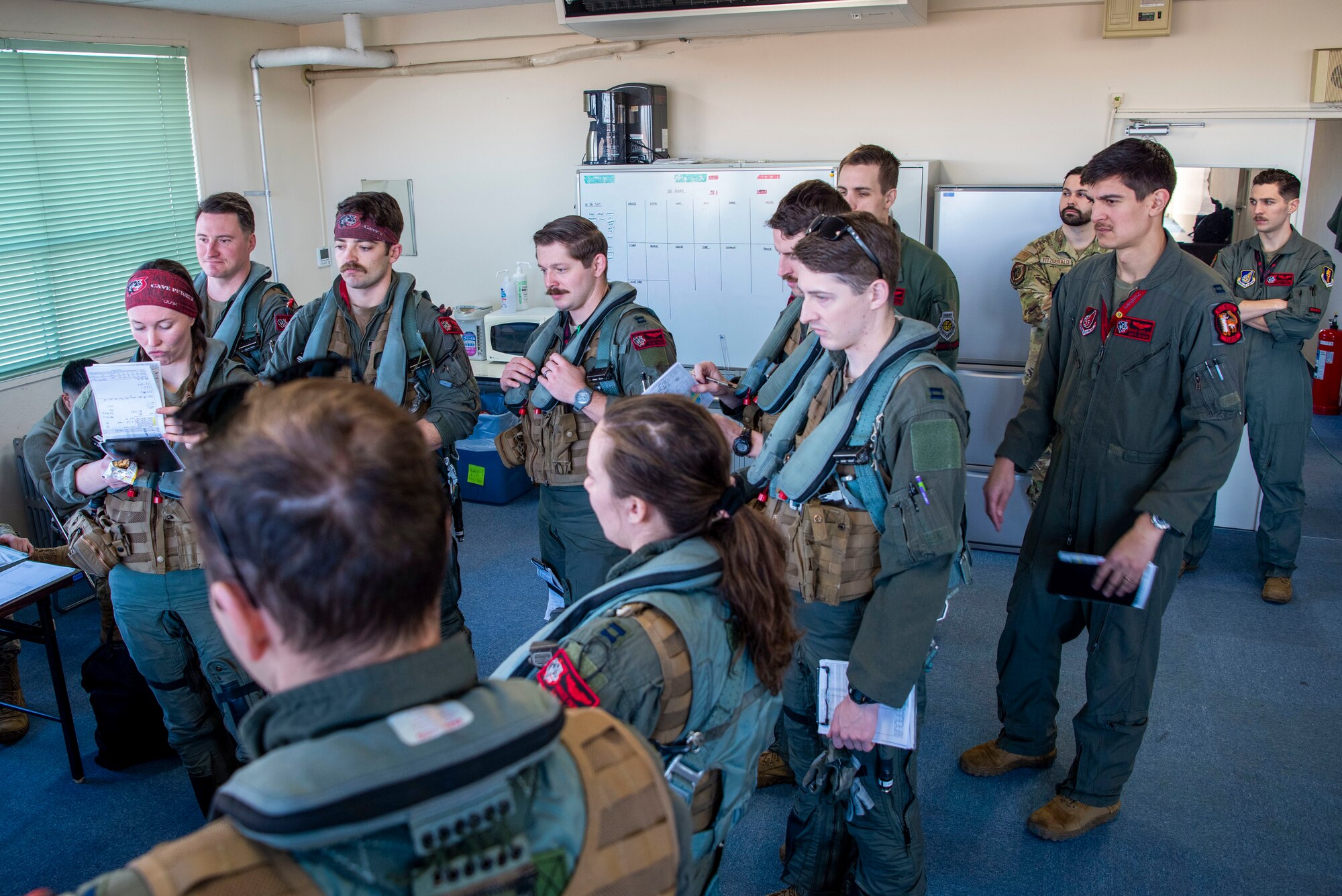 U.S. Air Force F-16 Fighting Falcon pilots receive a pre-flight brief prior to take-off during the Aviation Training Relocation exercise at Hyakuri Air Base, Japan, Jan. 29, 2024.