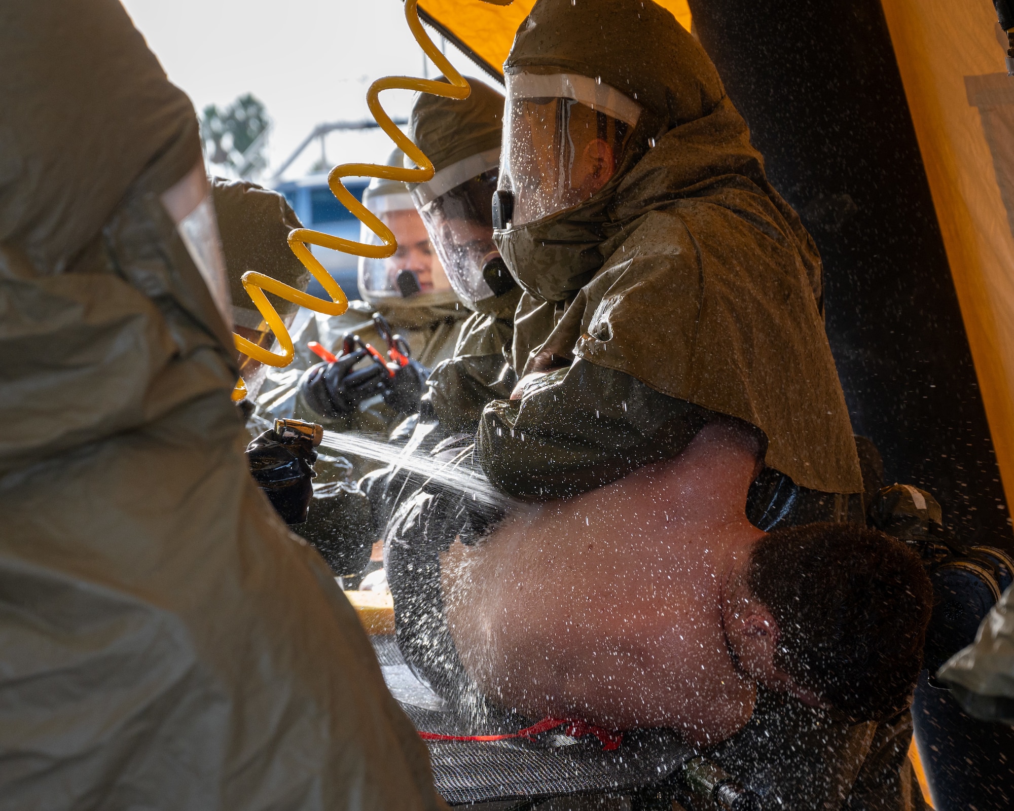 U.S. Air Force Airmen from the 47th Medical Group decontaminate a patient during exercise Ready Eagle II at Laughlin Air Force Base, Texas, Jan. 31, 2024. Exercise Ready Eagle II allowed Airmen to sharpen their response procedures, patient care skills, and increase service member survivability. Decontamination allows Airmen to clean off chemicals before moving them into the medical group for further treatment. (U.S. Air Force photo by Staff Sgt. Nicholas Larsen)
