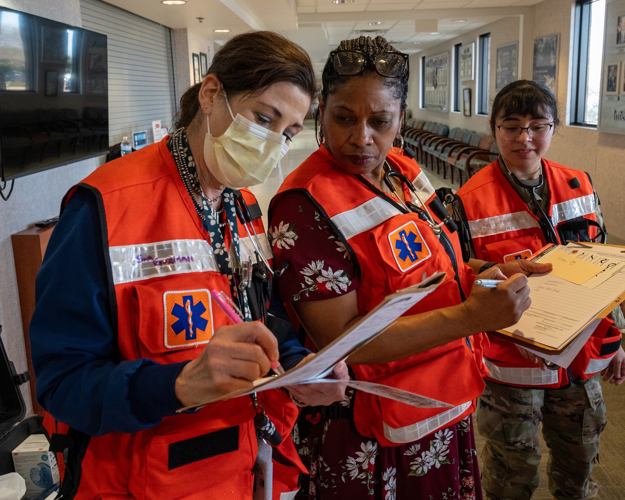 Medics from the 47th Medical Group review the patient files of casualties during exercise Ready Eagle II at Laughlin Air Force Base, Texas, Jan. 31, 2024. Exercise Ready Eagle II allowed Airmen to sharpen their response procedures, patient care skills, and increase service member survivability. While patients are waiting to be transported to higher-level care, they are constantly monitored for any changes in their health. (U.S. Air Force photo by Staff Sgt. Nicholas Larsen)