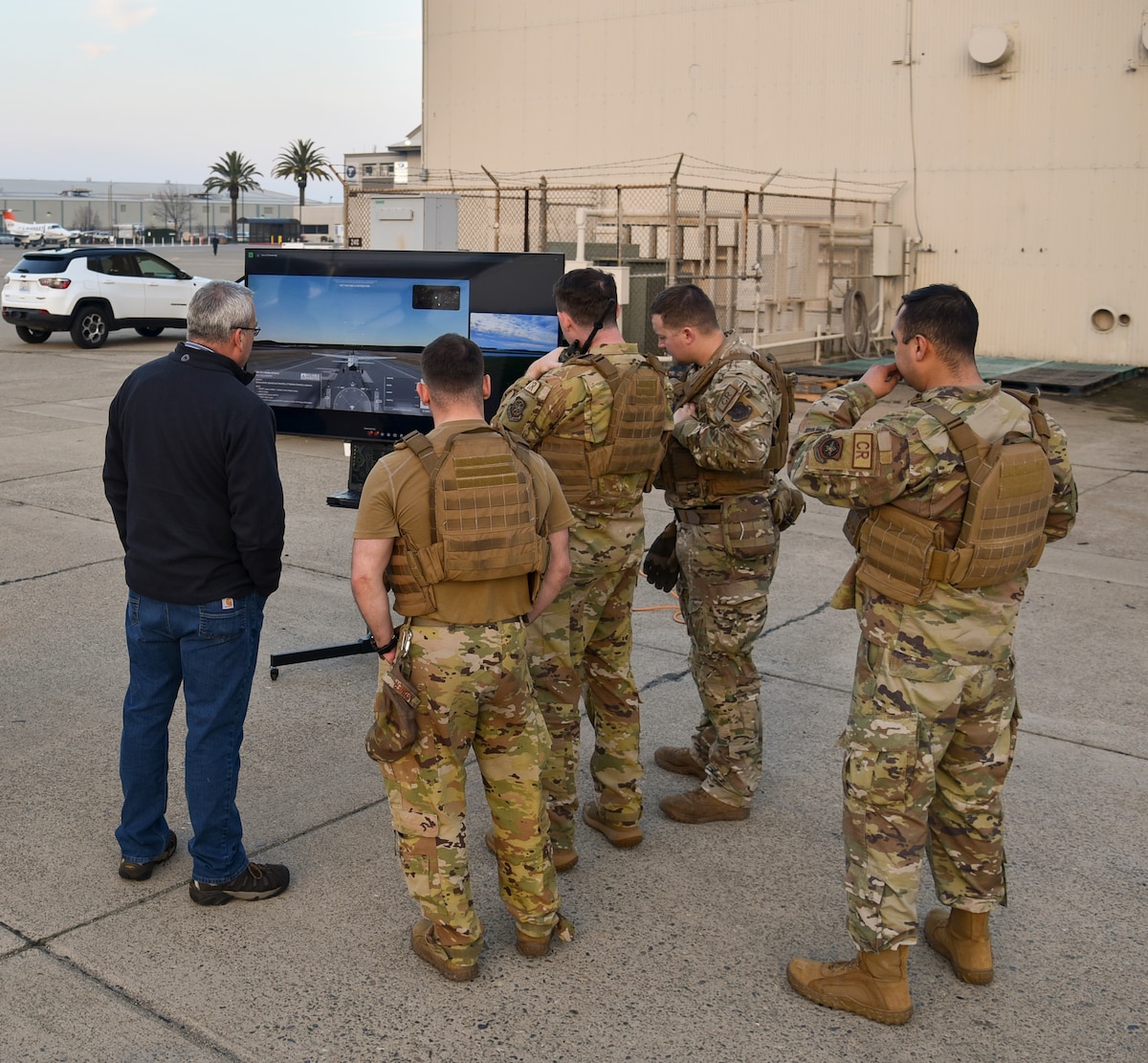 David O’Brien, left, Reliable Robotics senior vice president of government solutions, briefs Airmen about their autonomous flight capabilities during AGILE FLAG 24-1 at McClellan Airfield in Sacramento, Calif., Jan. 30, 2024.