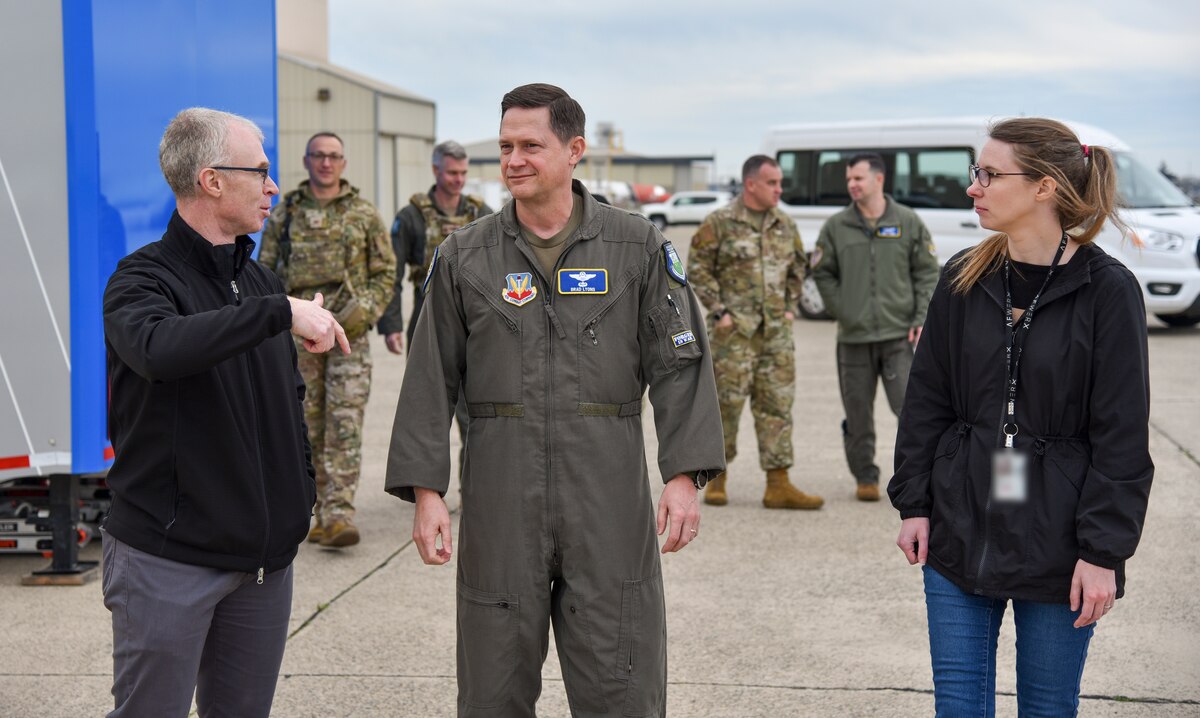 Chad Russell, left, AFWERX Prime flight test engineer, and Kate Brown, right, AFWERX Autonomy Prime deputy branch chief, brief Maj. Gen. David Lyons, 15th Air Force commander, about Autonomy Prime, an AFWERX innovation branch focused on the development and implementation of emerging autonomous technologies during AGILE FLAG 24-1 at McClellan Airfield in Sacramento, Calif., Jan. 31, 2024.