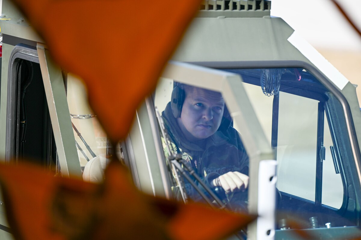 man drives vehicle with cargo