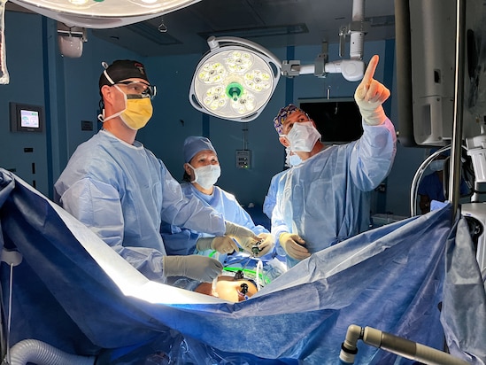 From the left, U.S. Navy Cmdr. Erik Olson, from Gardnerville, Nev., Belau National Hospital general surgeon Dr. Glenda Santos, and U.S. Navy Cmdr. Jason Butler, from Forest, La, perform a laparoscopic gall bladder surgery onboard the hospital ship USNS Mercy (T-AH 19), anchored off of Koror, Palau, as part of Pacific Partnership 2024-1, Jan. 3, 2024. Pacific Partnership, now in its 19th iteration, is the largest multinational humanitarian assistance and disaster relief preparedness mission conducted in the Indo-Pacific and works to enhance regional interoperability and disaster response capabilities, increase security stability in the region, and foster new and enduring friendships. (U.S. Navy photo by Cmdr. Cheryl Collins)