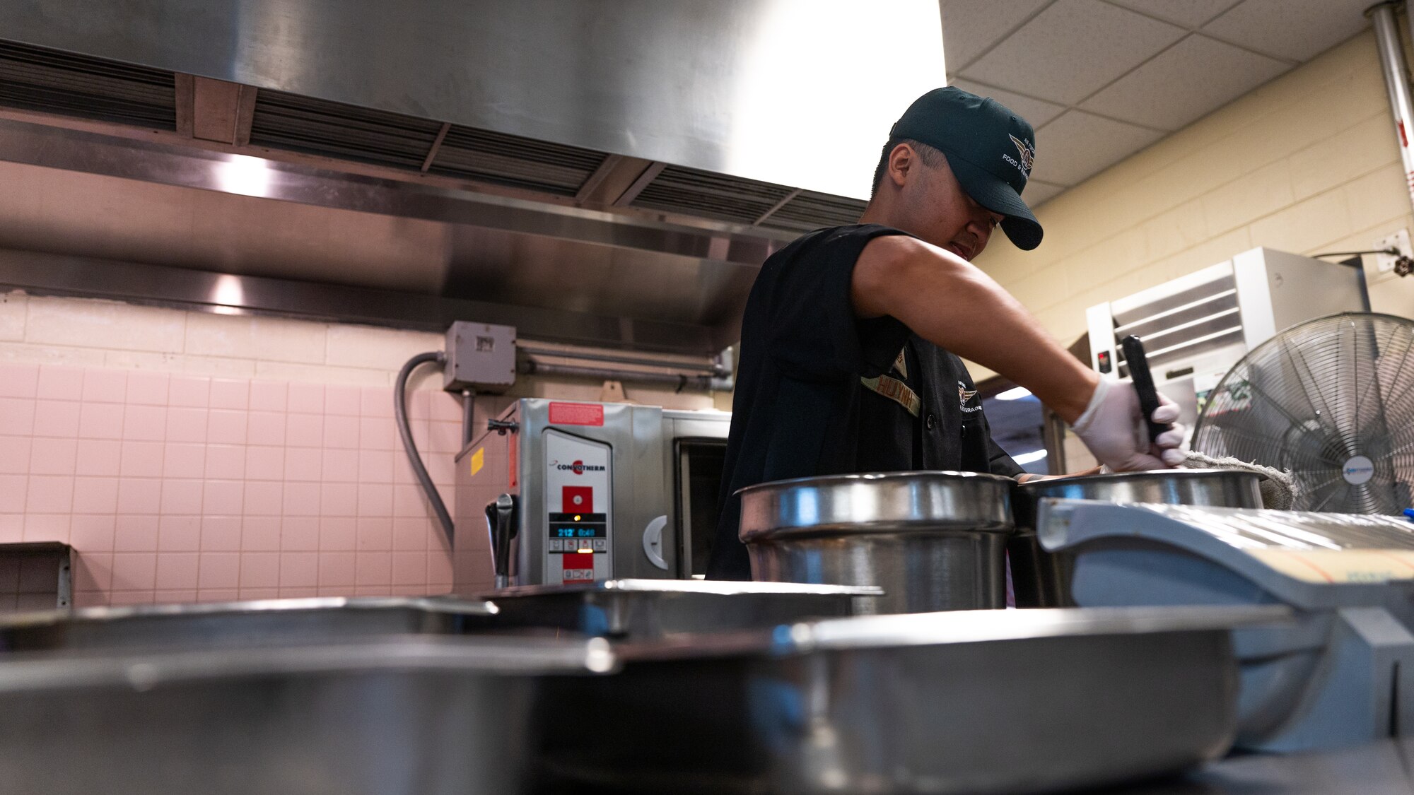 Staff Sgt. Huy Huynh prepares food for lunch service.