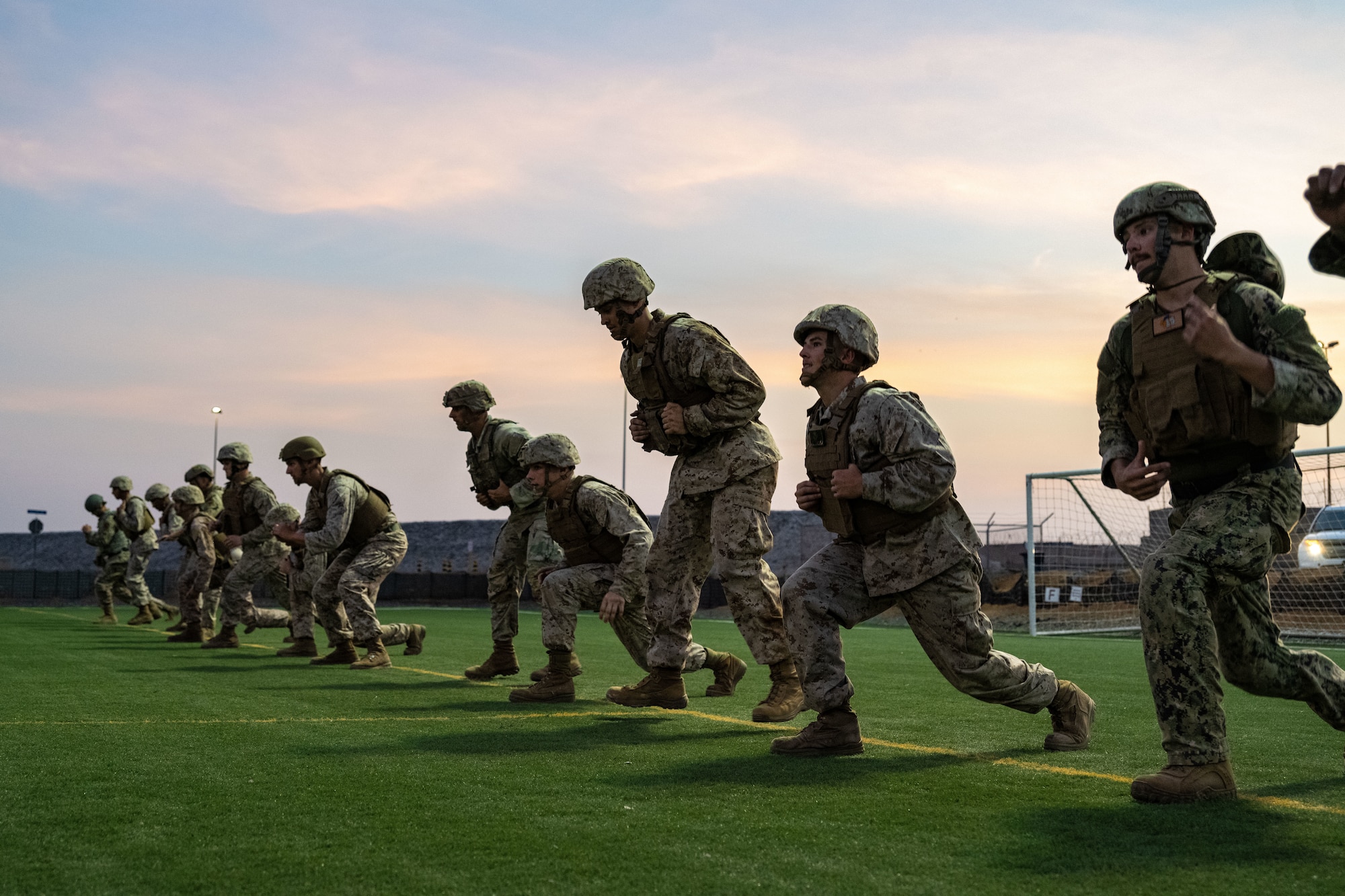 U.S. service members perform physical training exercises.