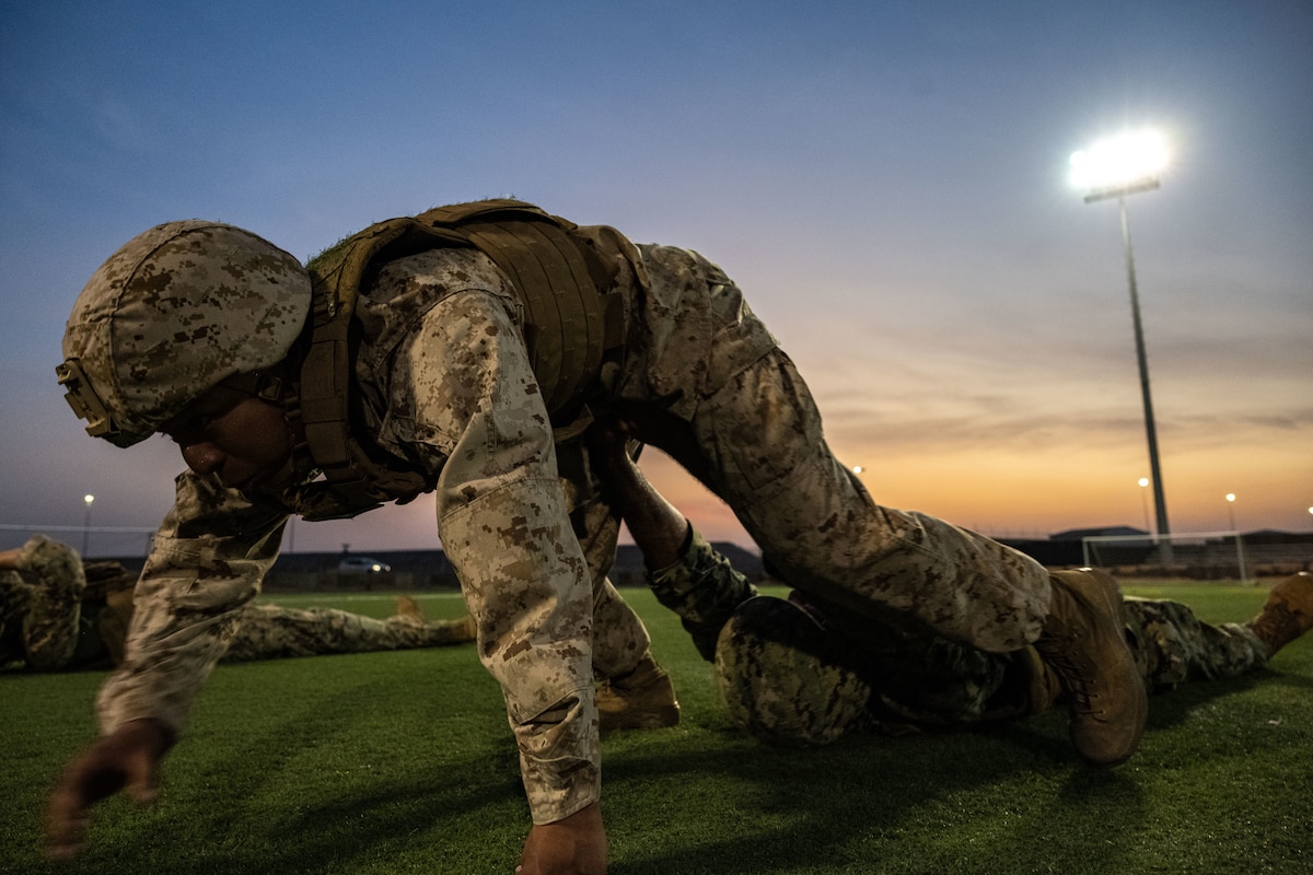 A U.S. Marine practices a body drag exercises.