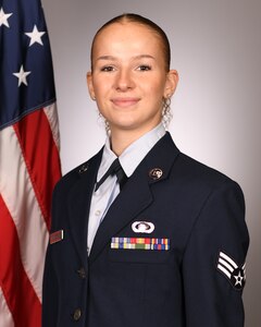 Official biography head and shoulders photo of a female airman.