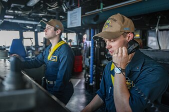 Sailors stand watch aboard USS John Finn (DDG 113) in the South China Sea.