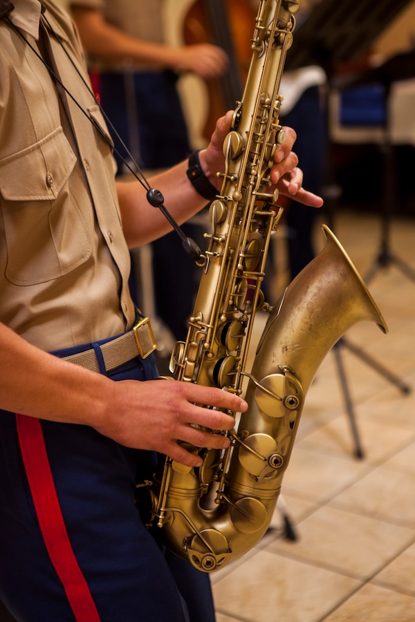 The 2nd Marine Aircraft Wing Band, Jazz Combo, participate in a cake cutting ceremony on Marine Corps Air Station Cherry Point, N.C., Oct. 13, 2017. The ceremony was held to celebrate and honor the U.S. Navy’s 242nd birthday. (U.S. Marine Corps photo by Sgt. Joselyn Jimenez)