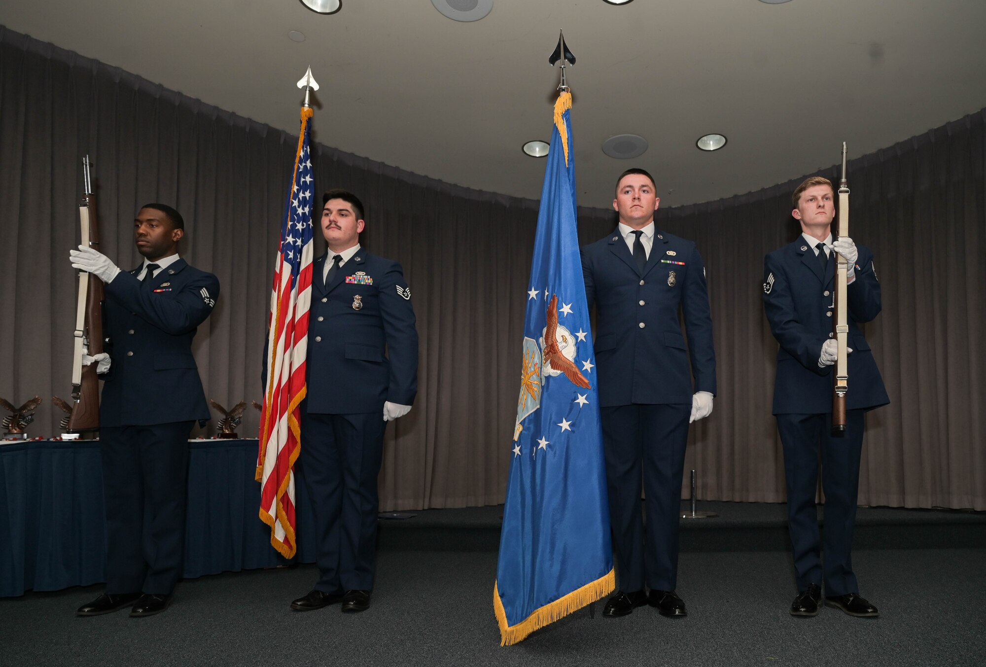 an honor guard presents the colors