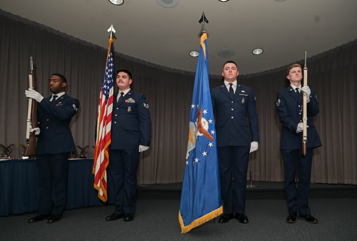 an honor guard presents the colors