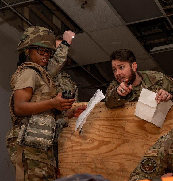 U.S. Air Force Staff Sgt Brendon Wright, 791st Missile Security Forces Squadron training and evaluations Airman, guides Airmen through a Tactical Combat Casualty Care (TCCC) training scenario at Minot Air Force Base, North Dakota, Jan. 19, 2024. TCCC is the new standard for military medical training for all U.S. military service branches, replacing the previous the Self-Aid and Buddy Care course. (U.S. Air Force photo by Senior Airman Alexander Nottingham)