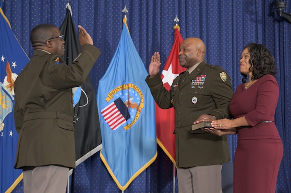 MG David Wilson administers the oath of office to Army Brig. Gen. Landis C. Maddox, DLA Troop Support commander, as his wife, Army Col. Yolonda Maddox watches on. Maddox was promoted to brigadier general during a ceremony at the Lieutenant General Andrew T. McNamara auditorium at Fort Belvoir, VA on January 26, 2024. Photo by Christopher Lynch, DLA Photographer