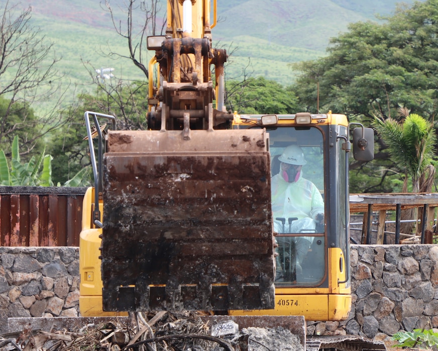 U.S. Army Corps of Engineers contractor removes debris from a residence in Lahaina, Hawai‘i,