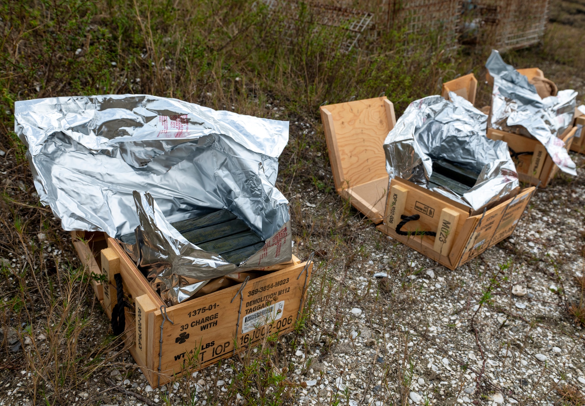 Crates of explosives sit at Avon Park Air Force Range, Florida, Jan. 24, 2024. More than 150 pounds of plastic explosives were used to conduct range clearance procedures. (U.S. Air Force photo by Airman 1st Class Leonid Soubbotine)