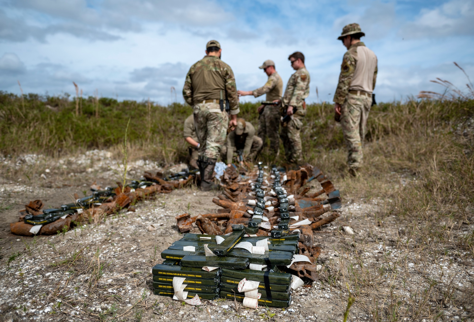 U.S. Air Force Airmen assigned to the 23rd Civil Engineer Squadron Explosive Ordnance Disposal unit finish range clearance preparations at Avon Park Air Force Range, Florida, Jan. 24, 2024. All branches of the DoD can participate in air and ground training at APAFR. (U.S. Air Force photo by Airman 1st Class Leonid Soubbotine)