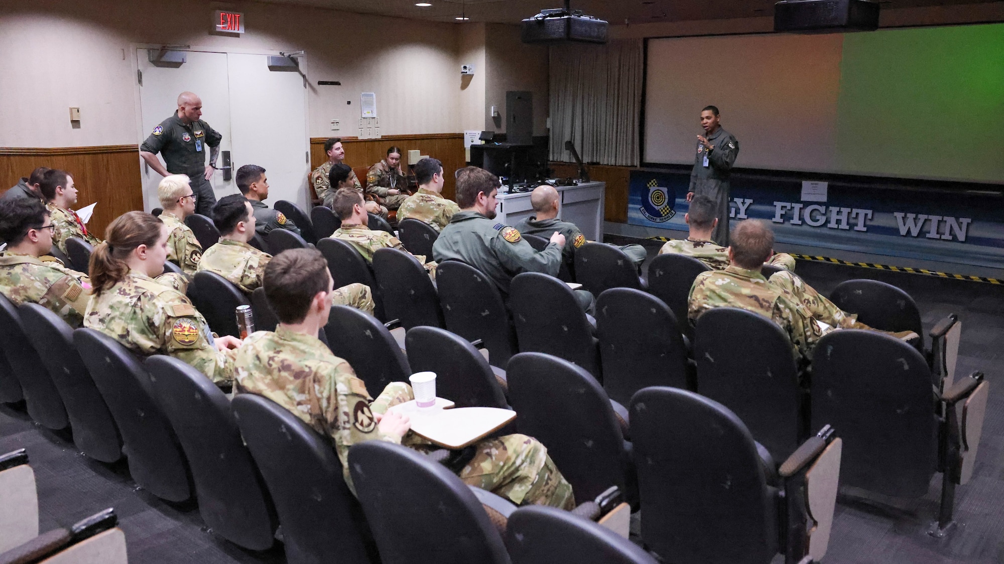 people in briefing room