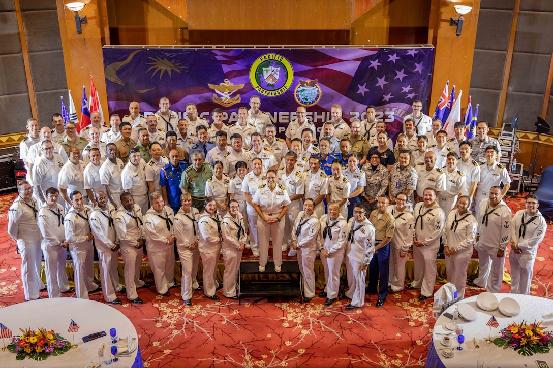 KUANTAN, Malaysia (Sept. 06. 2023) – Pacific Partnership 2023 leadership, Pacific Partnership 2023 staff and Malaysian service members pose for a group photo after opening ceremony at Swiss Garden Hotel in Kautan, Malaysia, Sept. 6. Now in its 18th year, Pacific Partnership is the largest annual multinational humanitarian assistance and disaster relief preparedness mission conducted in the Indo-Pacific. (U.S. Navy photo by Chief Mass Communication Specialist 2nd Class Megan Alexander)