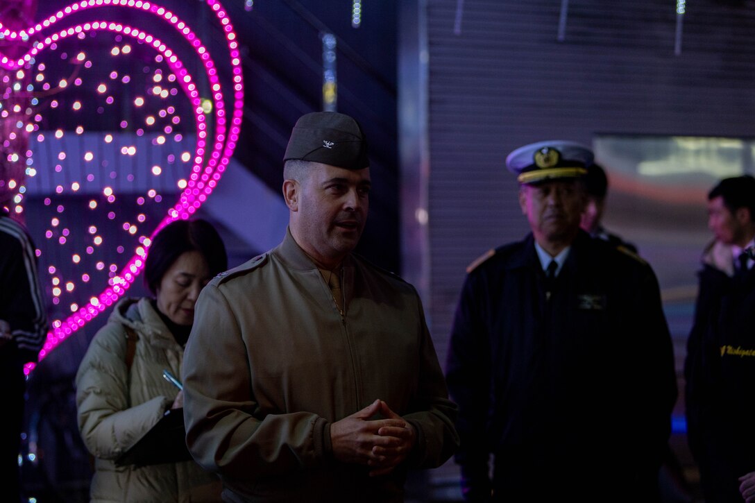 U.S. Marine Corps Col. Richard Rusnok, the commanding officer of Marine Corps Air Station Iwakuni, talks to Japan Maritime Self-Defense Force service members and community leaders during the Joint Leadership Walk in Iwakuni, Japan, Dec. 8, 2023.