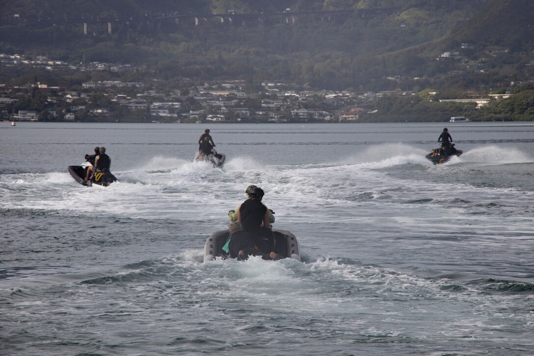 Special forces students participate in an iWaterman Maritime Reconnaissance Vehicle (MRV) course at Marine Corps Base Hawaii, Jan. 31, 2024. iWaterman is a program that teaches students how to utilize the MRV for tactical insertions, extractions, and rescues in high surf and over the beach operations. (U.S. Marine Corps photo by Sgt. Julian Elliott-Drouin)
