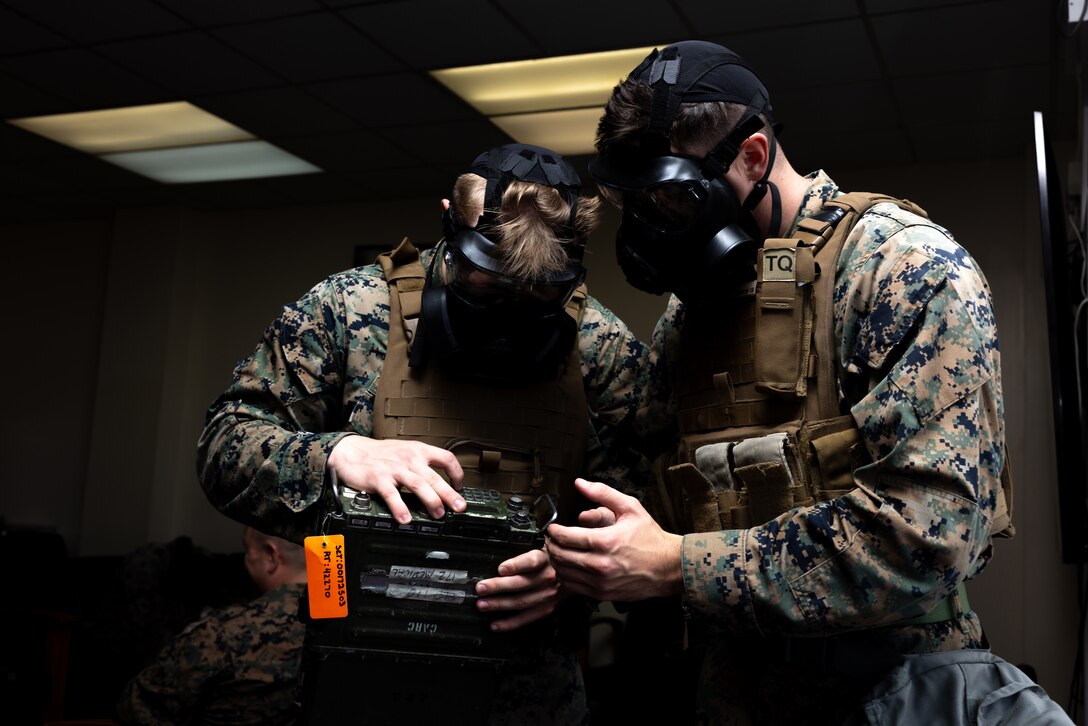 U.S. Marine Corps Lance Cpl. Alex Pearce, left, and Cpl. Theodore Smith, transmissions system operators with Marine Wing Support Squadron 172, 1st Marine Aircraft Wing, set up a RT-1796 during a Base Recovery After Attack and Airfield Damage Repair training exercise on Marine Corps Air Station Futenma, Feb. 4, 2024. This training event simulated how the joint-force would operate in the event of a foreign attack on U.S. military-owned airfields in Okinawa. MWSS-172 employed the use of explosive ordnance disposal, engineer, maintenance, and communication teams within their squadron for damage assessment and recovery. Pearce is a native of Pennsylvania and Smith is a native of Idaho. (U.S. Marine Corps photo by Cpl. Thomas Sheng)