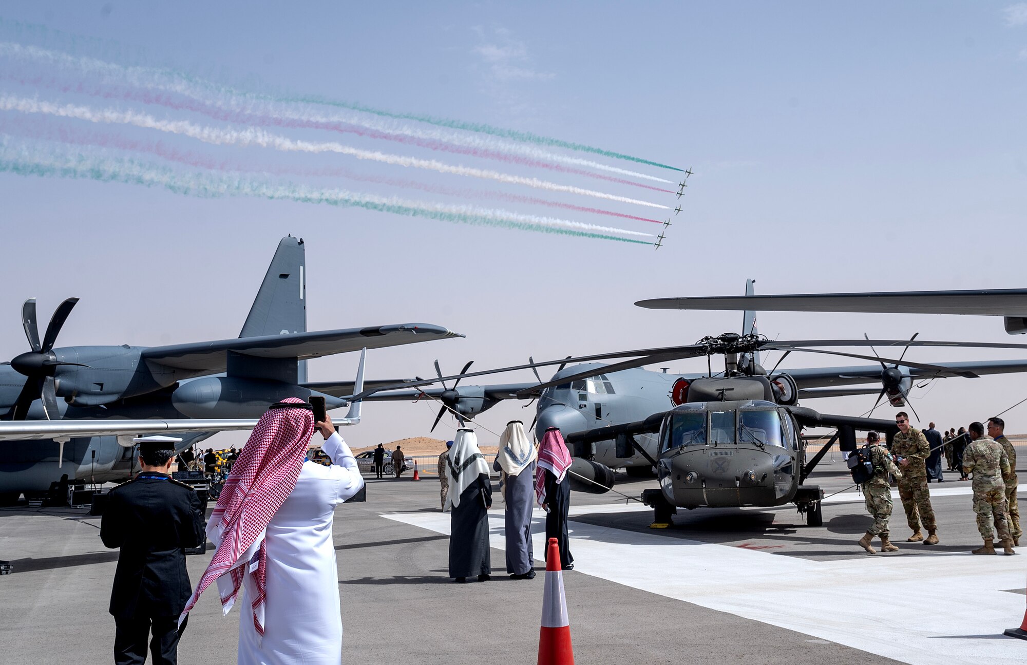 A multinational audience watches the XX perform an air demonstration as they tour U.S. military aircraft during the Saudi World Defense Show near Riyadh, Saudi Arabia, Feb. 4, 2024. Saudi Arabia’s WDS 2024, one of the region’s largest defense expositions, includes a wide array of aircraft and assets from across the U.S. Department of Defense. The U.S. values its shared commitment and close cooperation with Saudi Arabia, coalition allies, and partners, which has enhanced the collective ability to counter a range of regional threats as a unified fighting force. (U.S. Air Force courtesy photo)