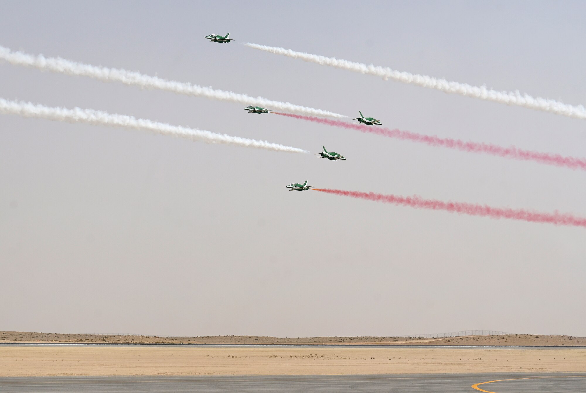 The Saudi Arabia aerobatics team, the Saudi Hawks performs during the Saudi World Defense Show near Riyadh, Saudi Arabia, Feb. 4, 2024. Saudi Arabia’s WDS 2024, one of the region’s largest defense expositions, includes a wide array of aircraft and assets from across the U.S. Department of Defense. The U.S.’s commitment of personnel and aircraft to the Saudi WDS highlights the importance of continued defense cooperation between allies and partners with a shared vision for enduring peace and stability in the region. (U.S. Air Force Courtesy Photo)