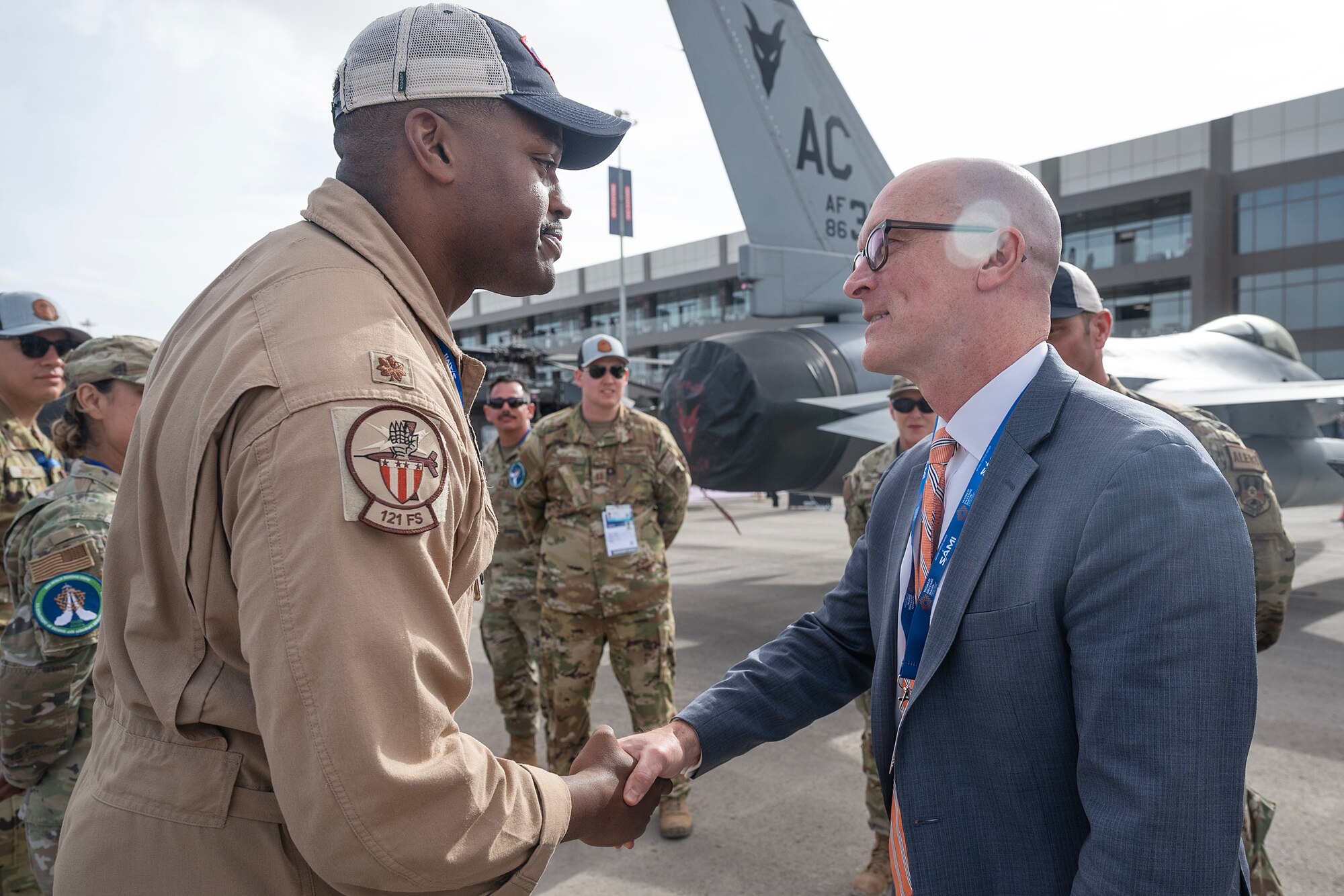 Men shake hands.