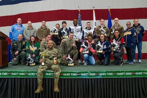 U.S. Air Force members from the 51st Fighter Wing display their accolades on stage after being announced the winners for their respective categories during the 51st FW 2023 Annual Award Ceremony at Osan Air Base, Republic of Korea, Feb. 8, 2024.